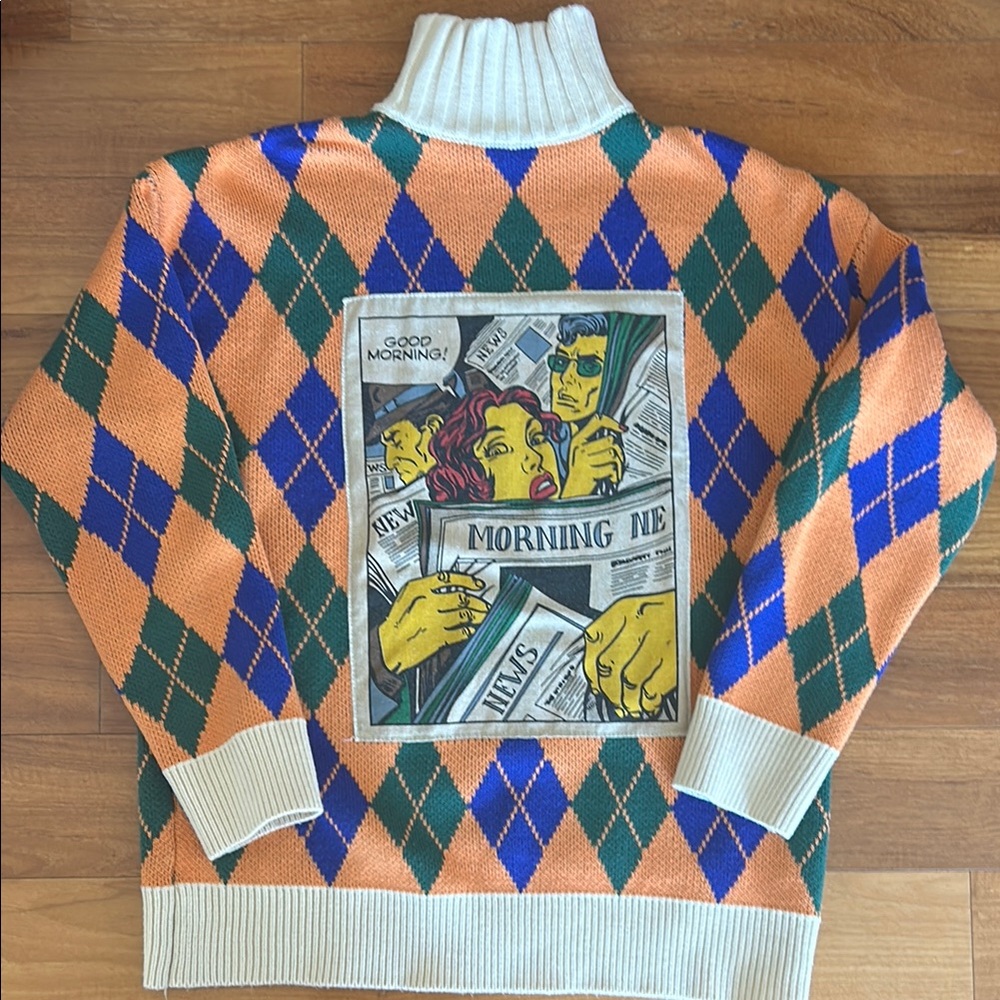 Orange and Blue Turtleneck Sweater with Argyle Pattern and Graphic Design